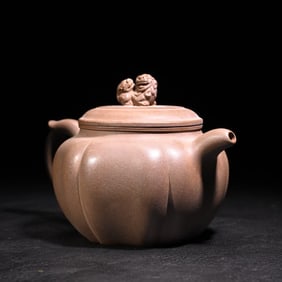 An early double lion ball purple clay pot