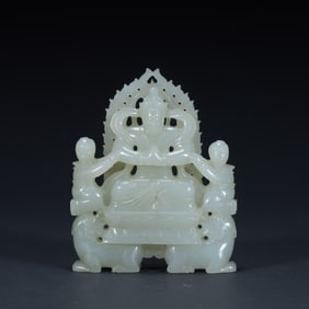 A seated statue of a white jade boy worshiping Guanyin in the Qing Dynasty