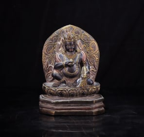 A black stone carved yellow God of Wealth