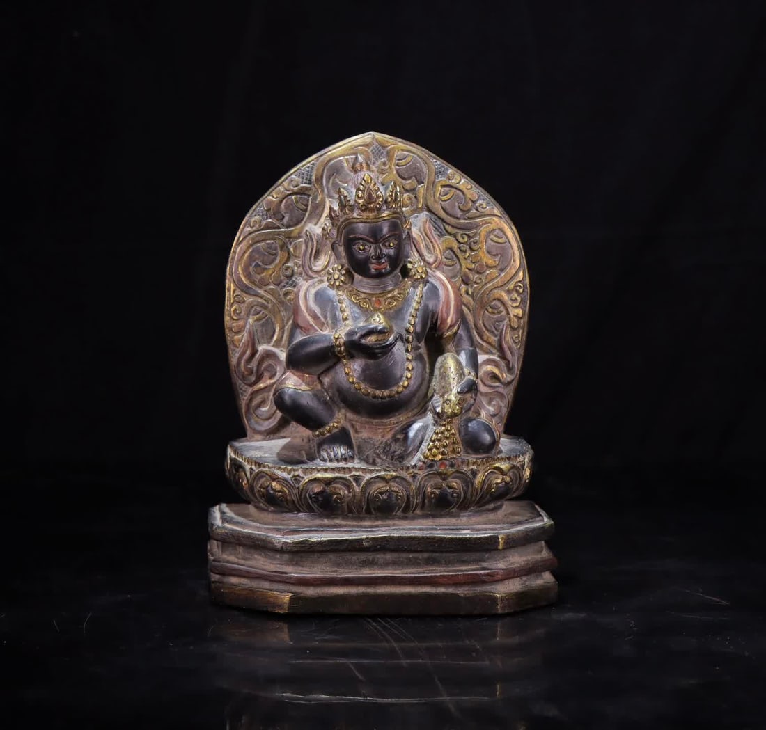 A black stone carved yellow God of Wealth (1 of 8)
