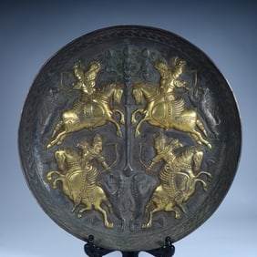 A Qing Dynasty silver-gilt hunting pattern plate
