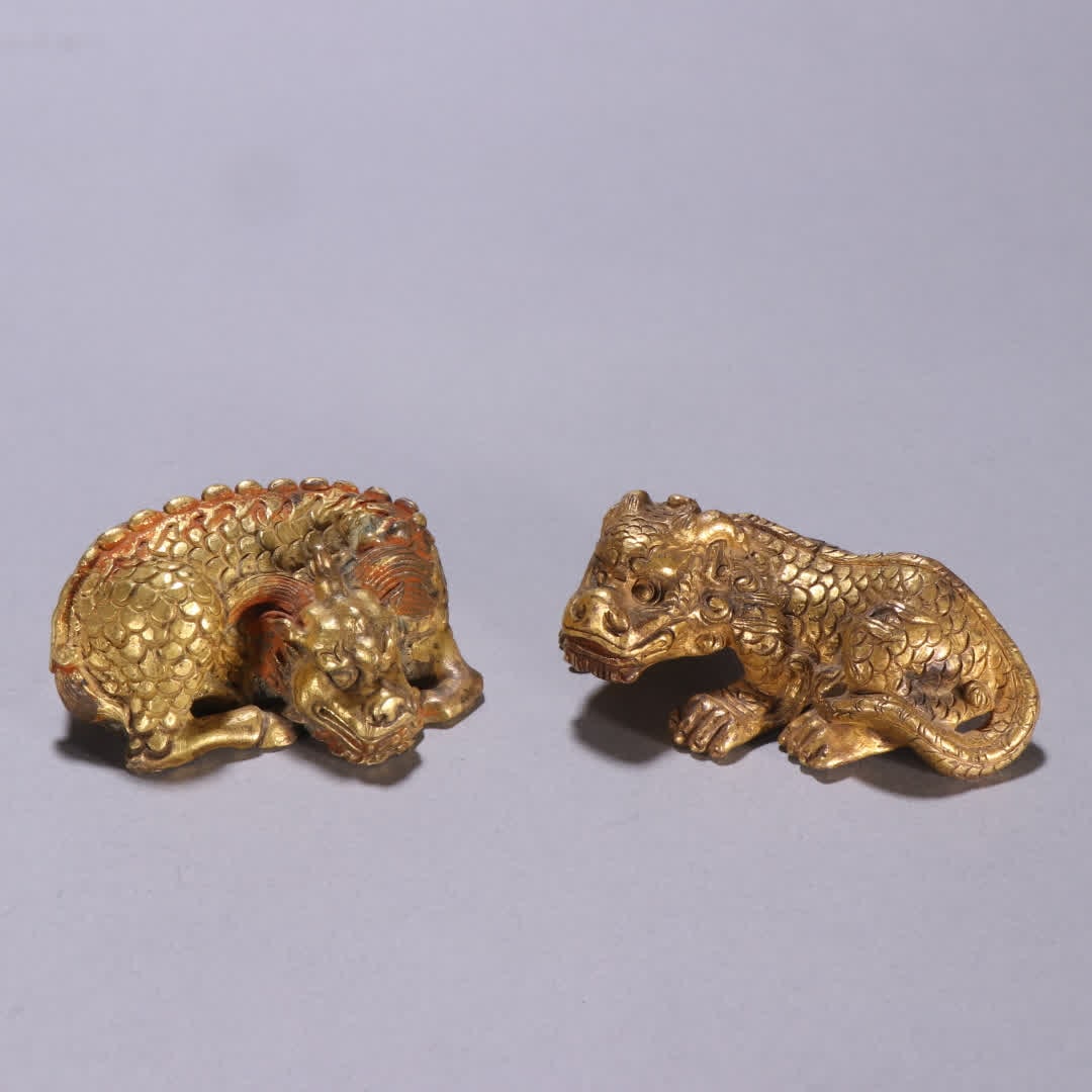 A pair of copper gilt beast paperweights from the Ming Dynasty (1 of 9)