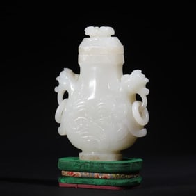 A Qing Dynasty Hetian white jade carved double phoenix ring appreciation bottle