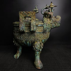 A Warring States bronze cloud pole, a tiger head tripod