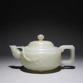 A Qing Dynasty Hetian jade carved poetry teapot