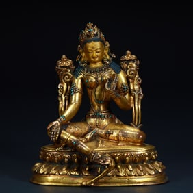 A Qing Dynasty bronze gilt green Tara statue