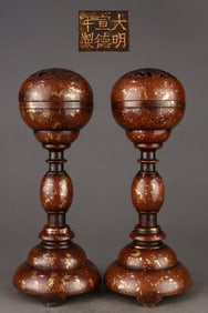 A pair of Ming Dynasty precision cast copper tires dotted with gold sprinkled official hat holder