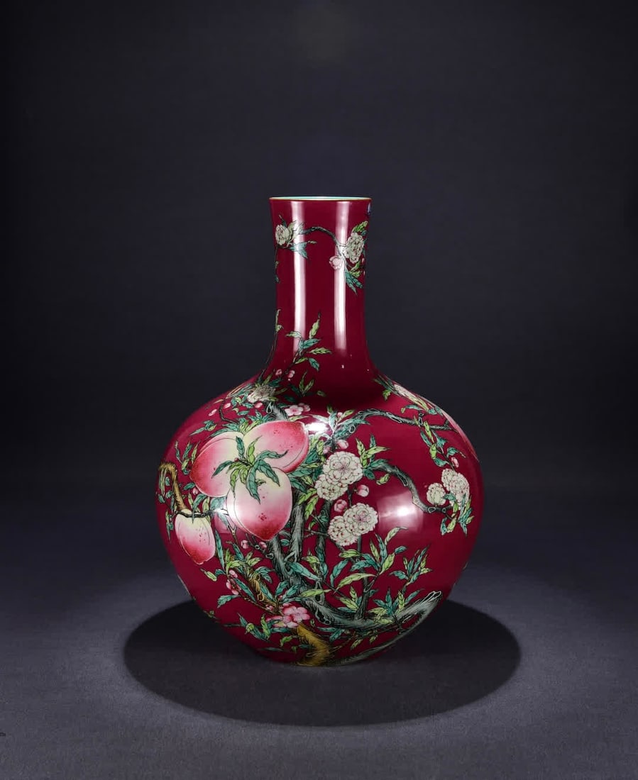 A Qing Qianlong red ground pastel nine peaches and five blessings Tianqiu vase (1 of 9)