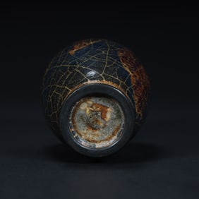 A Qing Dynasty Jun kiln moon white glaze purple spotted bottle