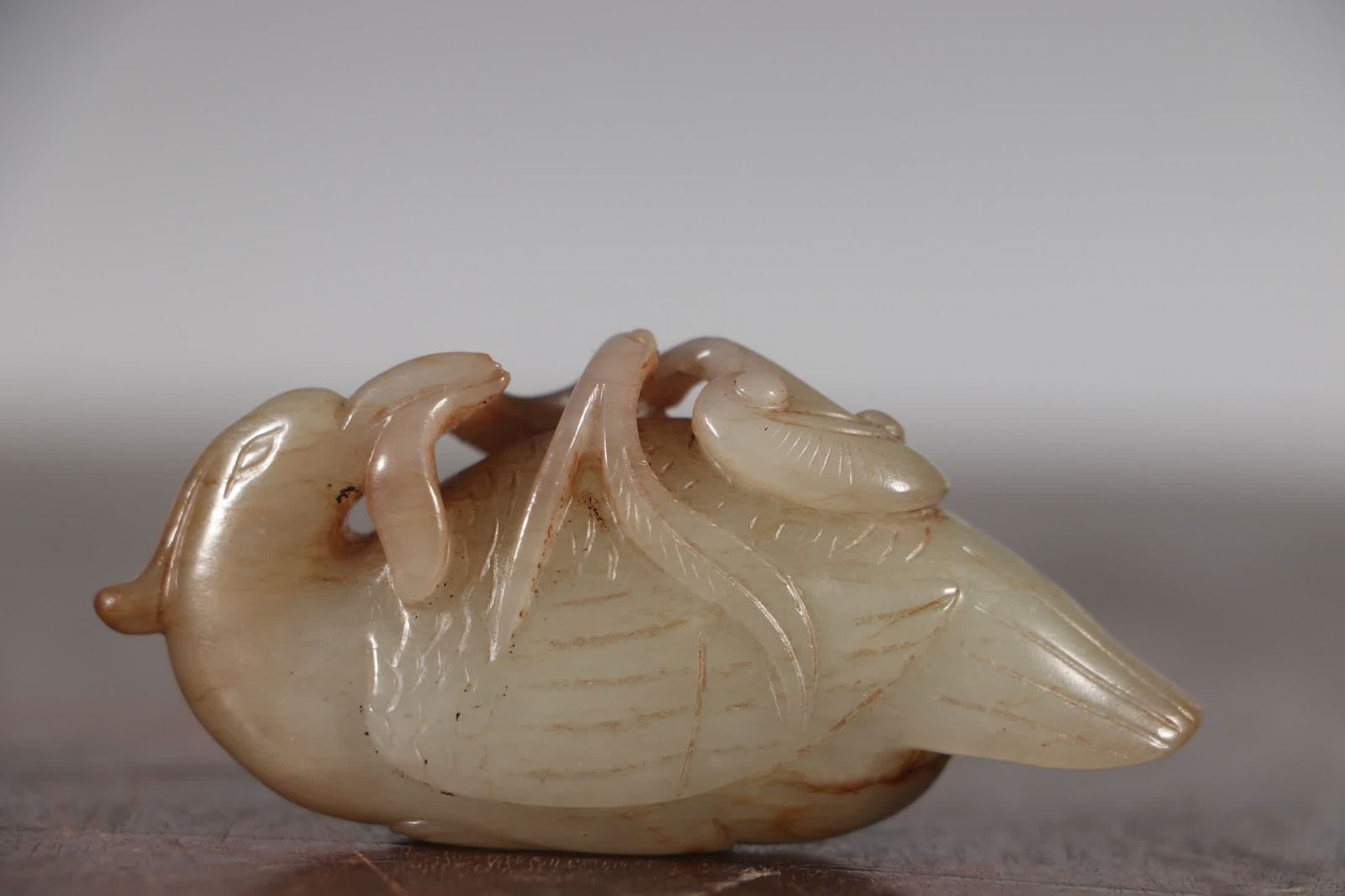 A carving of a Qing Dynasty Hetian jade goose holding Ganoderma lucidum (1 of 8)