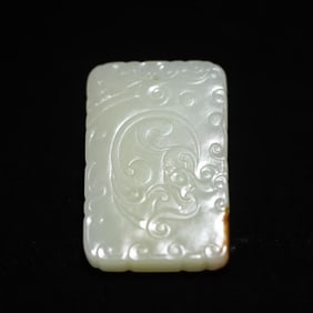 A Qing Dynasty Hetian jade with leather Kui dragon pattern plaque