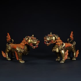 A Qing Dynasty copper-gilt and colorful lion ornament (a pair