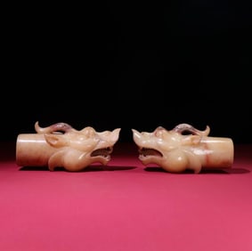 A pair of Han Dynasty jade dragon head inlays