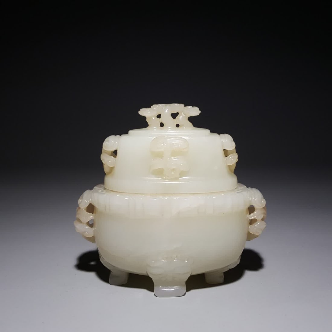 A Qing Dynasty Hetian jade beast foot ruyi ear furnace: Qing Dynasty Hetian jade beast foot ruyi ear furnace SIZE: 7.7x8.2x4.4cm W:216g (The Dimensions Of All Batches Are Manually Measured.If You Need More Detailed Information, Please Contact Our Customer