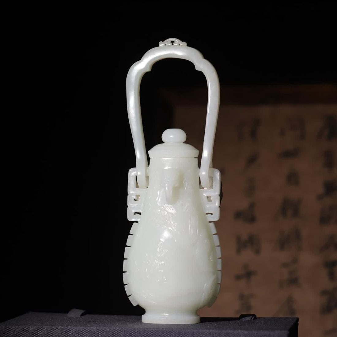 A Qing Dynasty Hetian jade gashi with a child carrying a beam bottle (1 of 11)