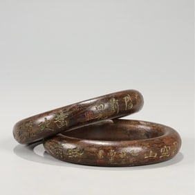 A pair of Qing Dynasty Qi Nan agarwood Shang Xian poetry bracelets