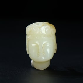 A head ornament of a medieval jade flying boy