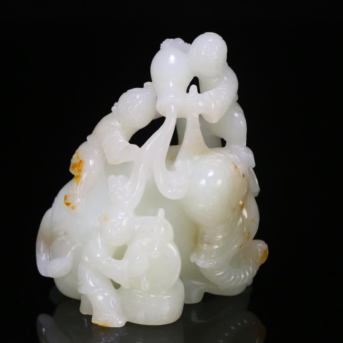 A Hetian jade seed material boy play ornament (1 of 9)