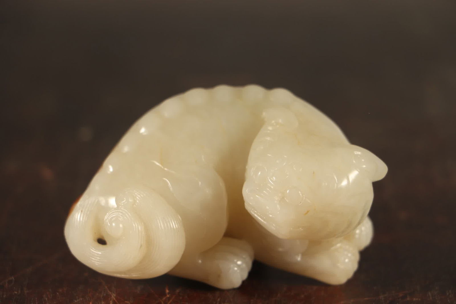 A Qing Dynasty Hetian jade beast ornament (1 of 8)