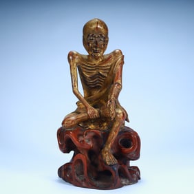 A statue of a skinny Arhat in the Qing Dynasty lacquered with wooden tires
