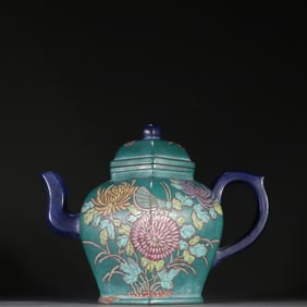 A Qing Dynasty purple sand painted pattern teapot