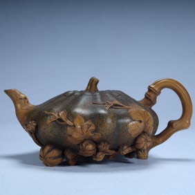 A Qing Dynasty purple sand pumpkin pattern pot