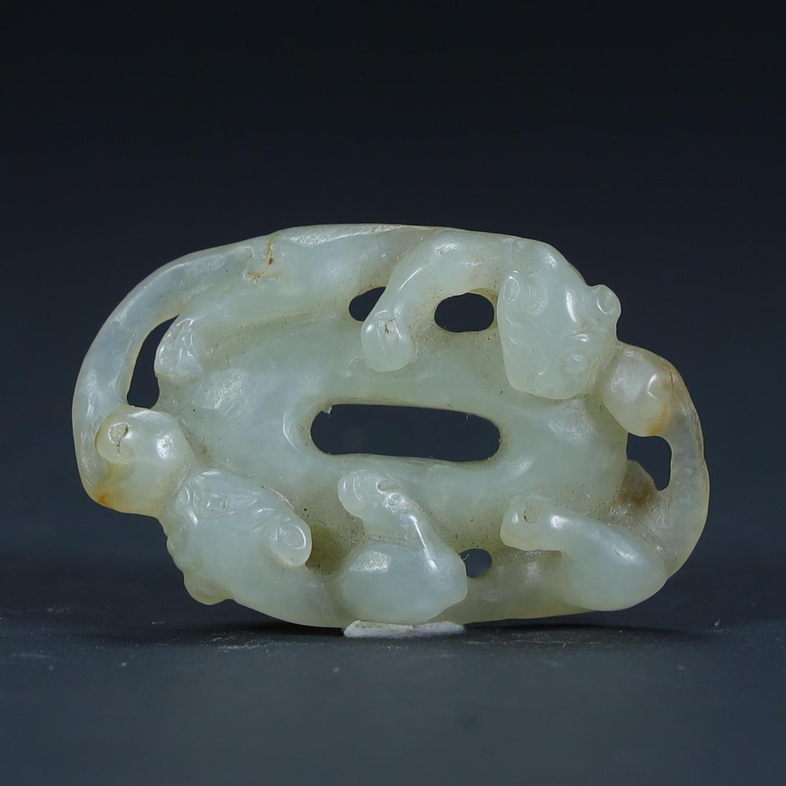 A Qing Dynasty Hetian jade "Shuanghuan" carving (1 of 8)