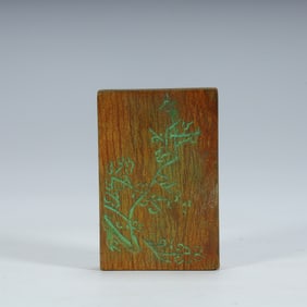 A Qing Dynasty woodcut plum pattern plaque