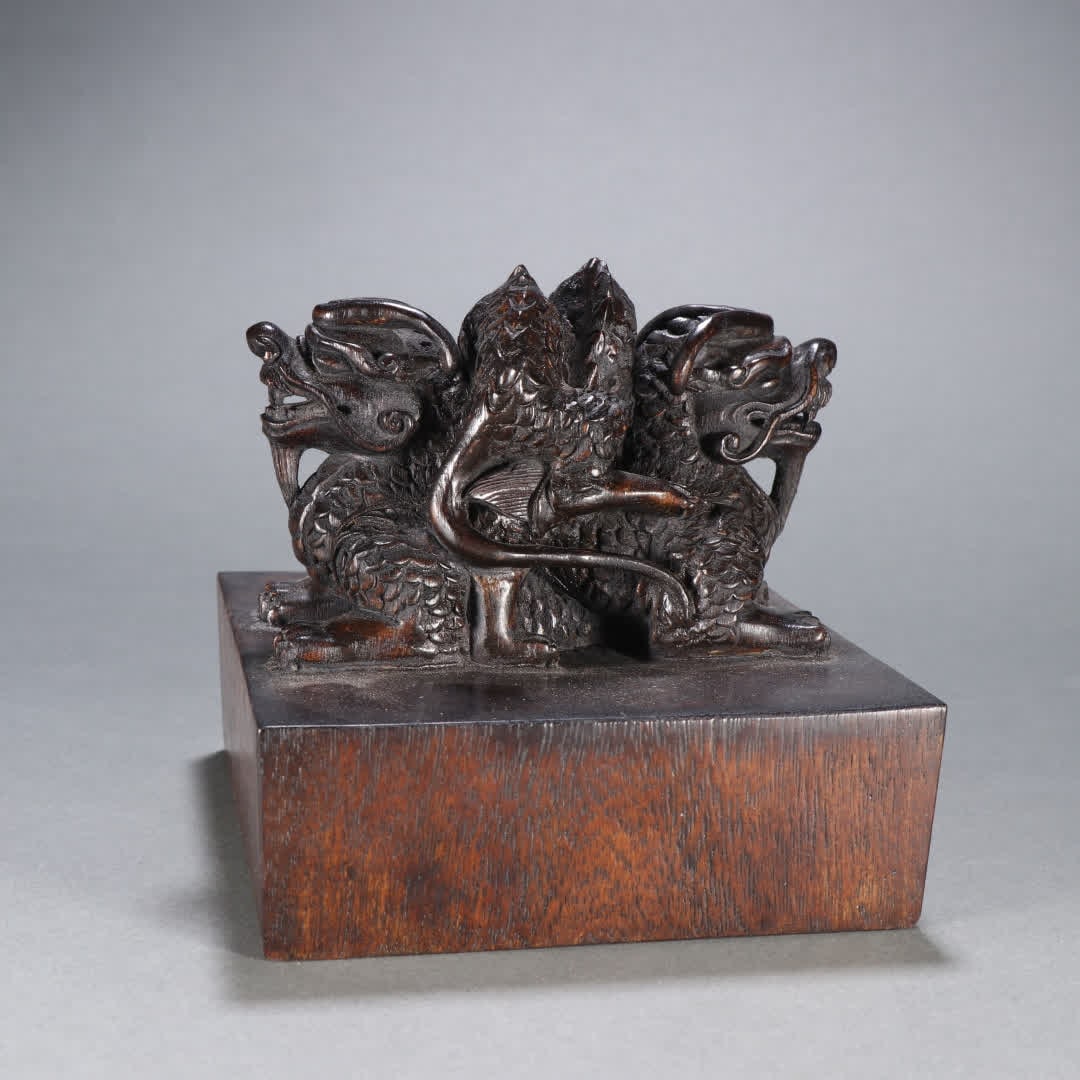 A Qing Dynasty agarwood dragon button seal (1 of 9)