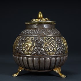 A Qing Dynasty silver-gilt Tibetan auspicious pattern lid jar