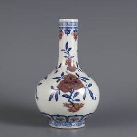 A blue and white glazed red three-pattern gall bottle made in the Qing Yongzheng era