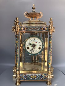 An antique antique enamel color mechanical pendulum clock