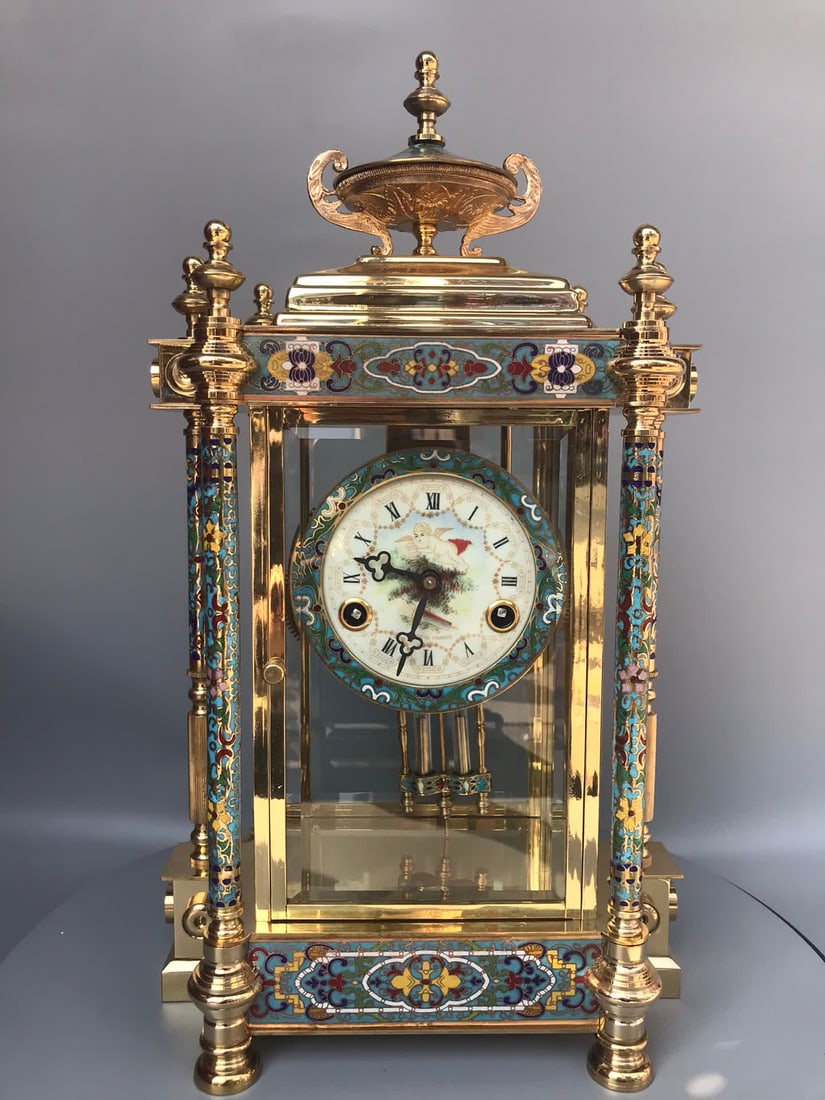 An antique antique enamel color mechanical pendulum clock (1 of 9)