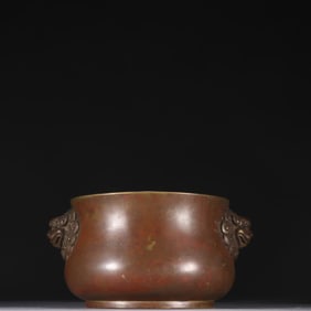 A Ming Dynasty Xuande copper tire double lion ear incense burner