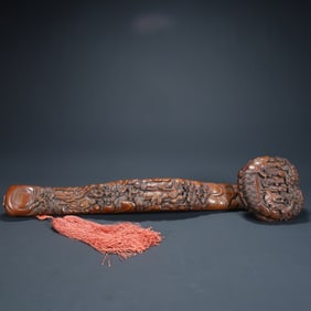 A Qing Dynasty boxwood carving eighteen Arhat pattern ruyi ornament