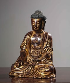 A seated statue of Shakyamuni carved in gold lacquered with sandalwood