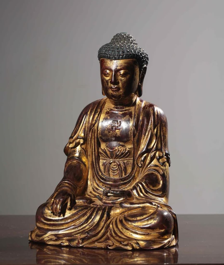 A seated statue of Shakyamuni carved in gold lacquered with sandalwood (1 of 9)