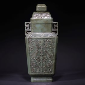A Qing Dynasty jasper carved entwined lotus pattern square bottle