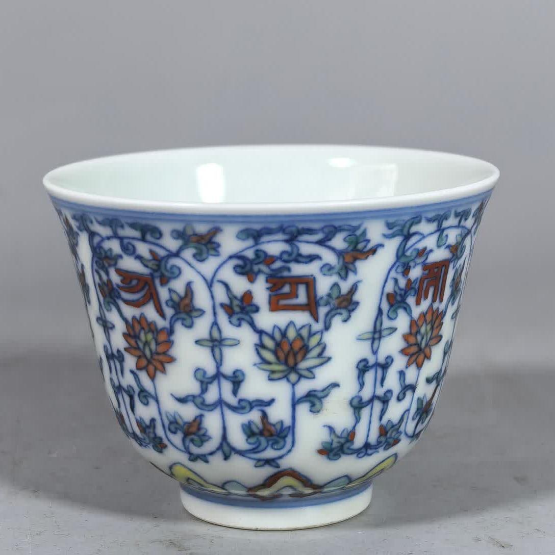 A Qing Yongzheng blue and white Doucai entwined lotus Sanskrit cup (1 of 8)