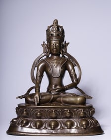 A seated statue of the longevity Buddha in the Qing Dynasty alloy copper and silver