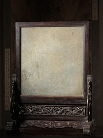 A Qing Dynasty small-leaved rosewood carved double dragon inlaid with an end stone insert