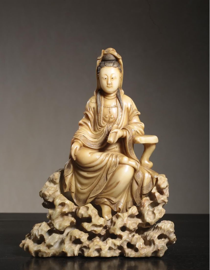 A stone carving of Guanyin in the Qing Dynasty: Qing Shoushan stone carving Guanyin seated statue holding scriptures SIZE: L:15cm W:6cm H:20cm (The Dimensions Of All Batches Are Manually Measured.If You Need More Detailed Information, Please