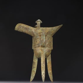 A bronze animal face cup