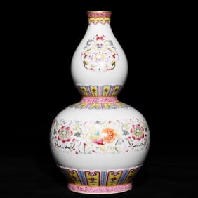 A Qing Qianlong pastel gold-painted eight-treasure floral gourd bottle