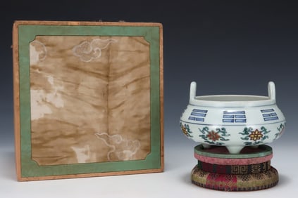 A Ming Jiajing Doucai Bagua three-legged amphora stove