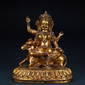 A statue of a Qing Dynasty bronze gilt six-armed donkey protector