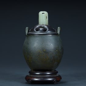 A Qing Dynasty copper tea powder glazed three-legged aromatherapy stove