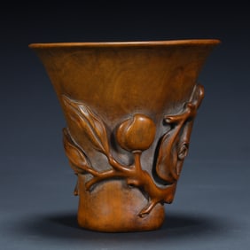 A Qing Dynasty boxwood carving "longevity peach pattern" cup