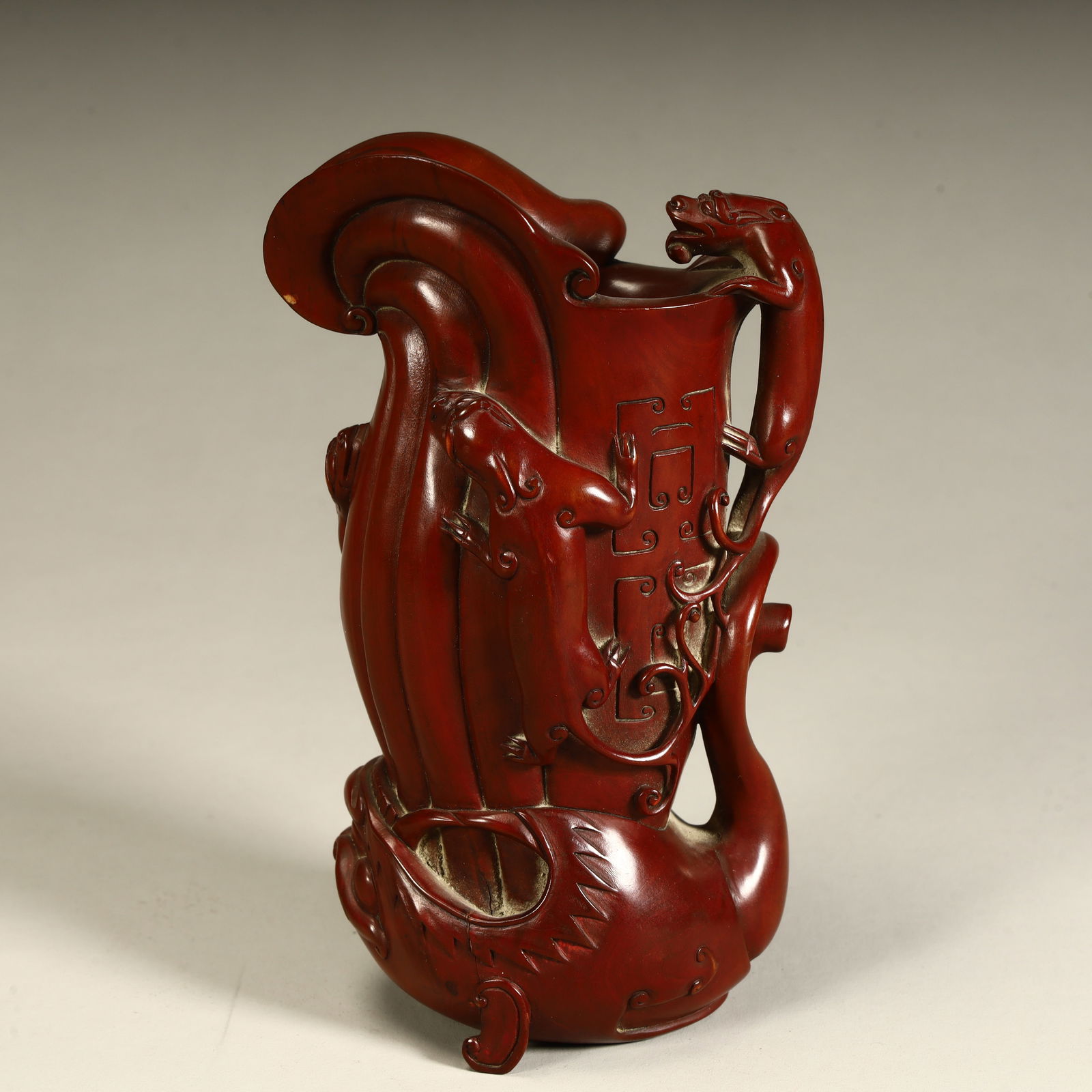 A Qing Dynasty boxwood carved beast swallowing a cup: Qing Dynasty boxwood carved beast swallowing cup size SIZE: H:14cm L:8.5cm W:5.5cm W:226.5g (The Dimensions Of All Batches Are Manually Measured.If You Need More Detailed Information, Please Contact O