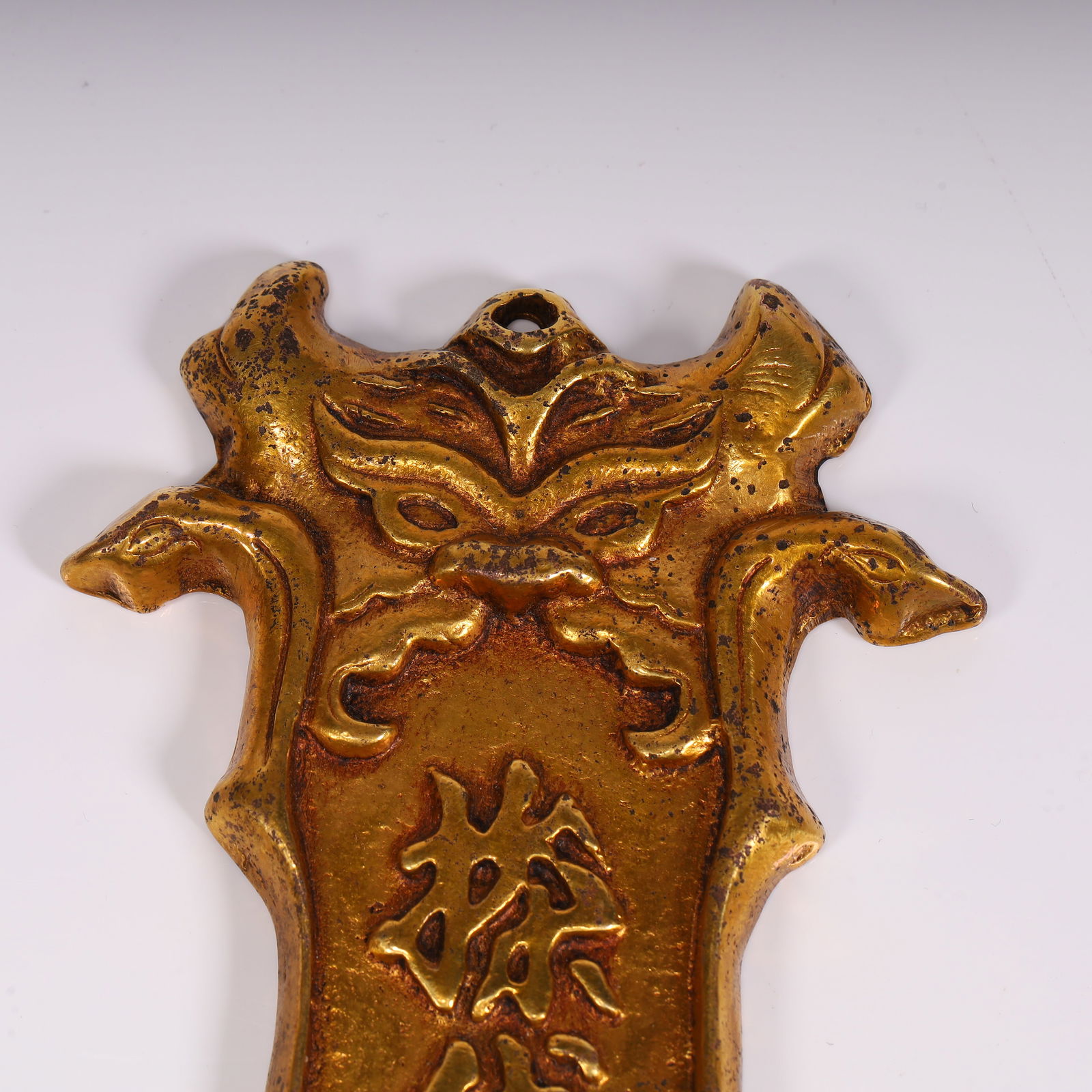 A copper-gilt token - 5